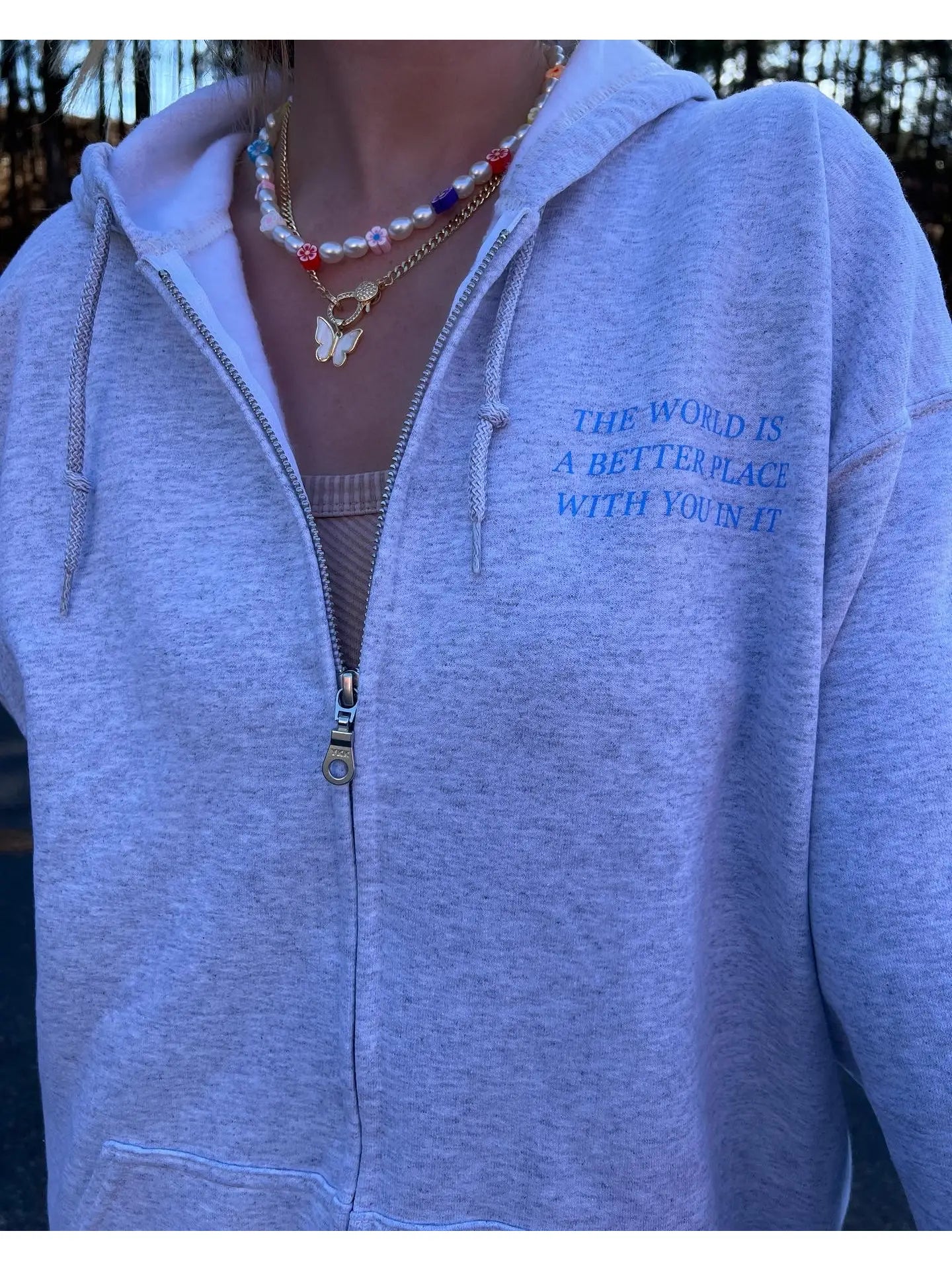 THE WORLD IS A BETTER PLACE WITH YOU IN IT ZIP UP HOODIE